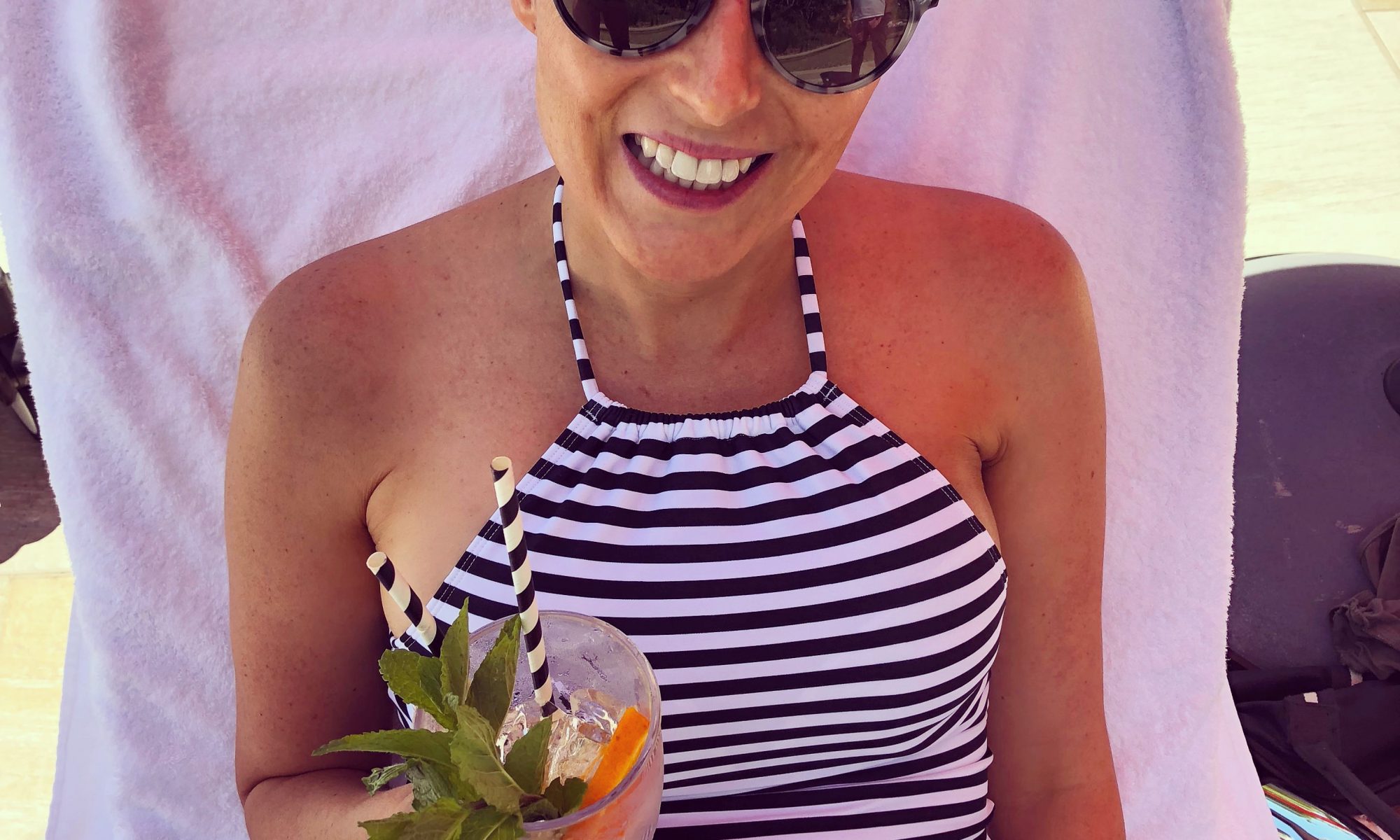 Louise DeCelis drinking a cocktail in Byron Bay