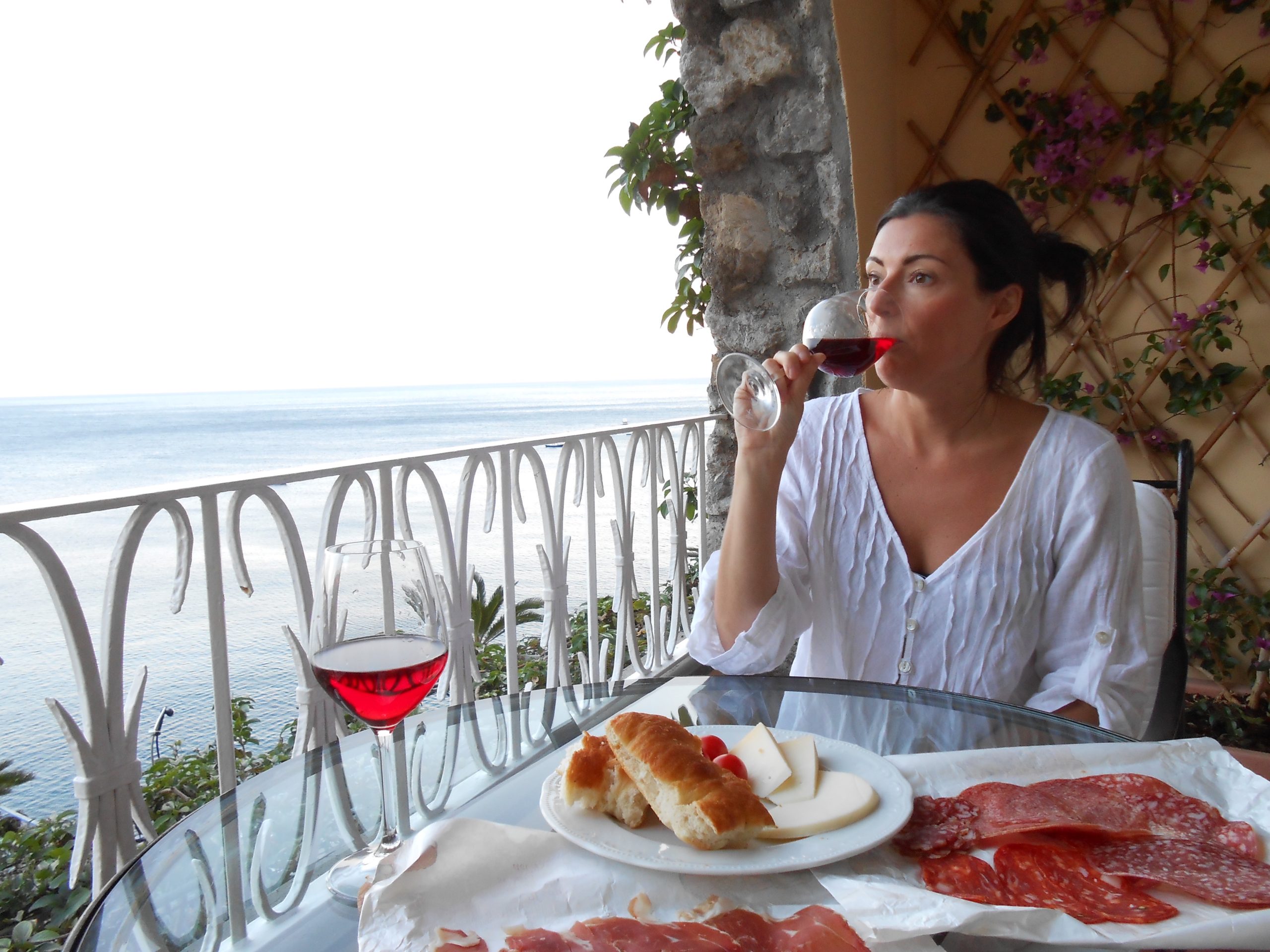 louise decelis drinking wine on Amalfi coast