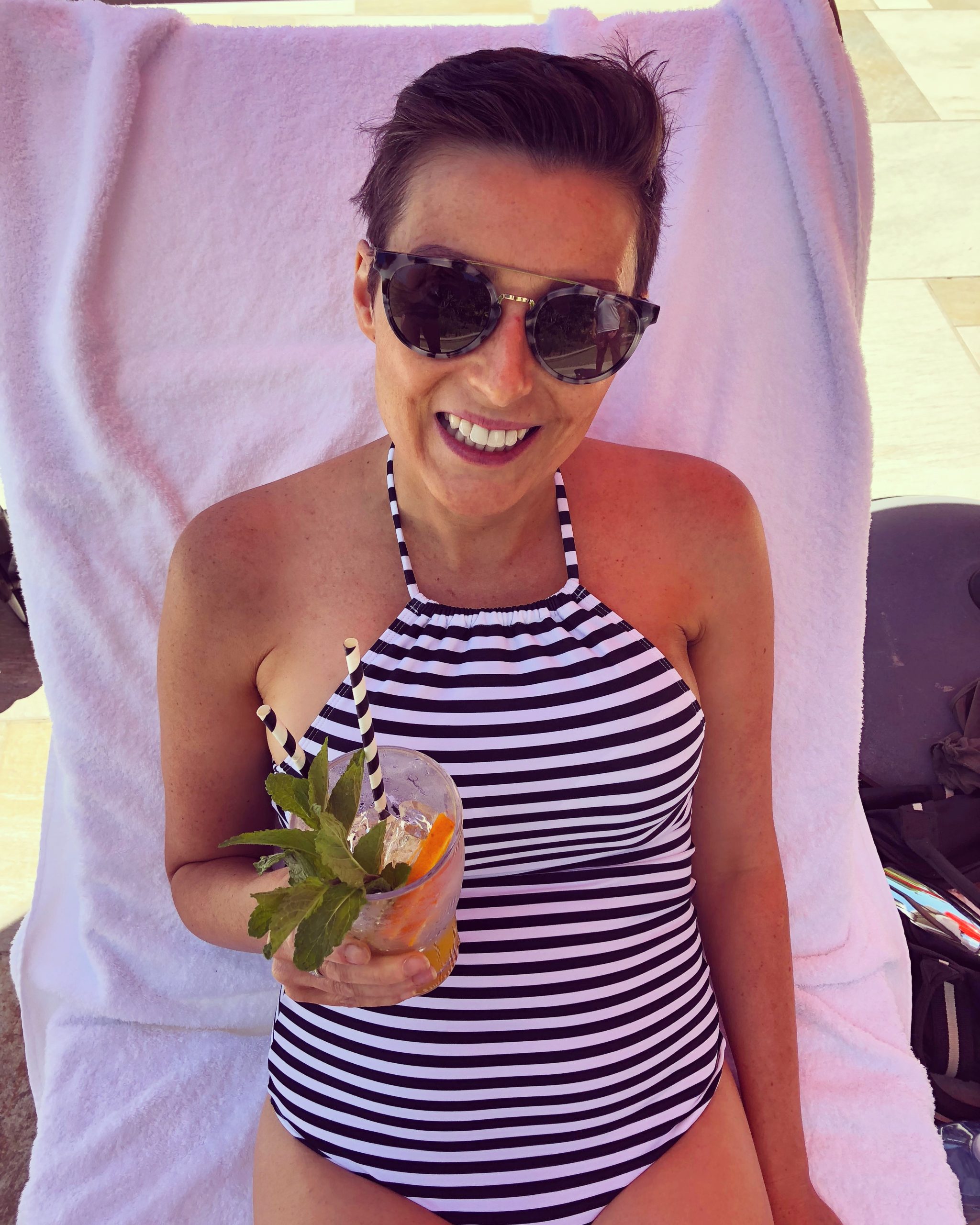 Louise DeCelis drinking a cocktail in Byron Bay