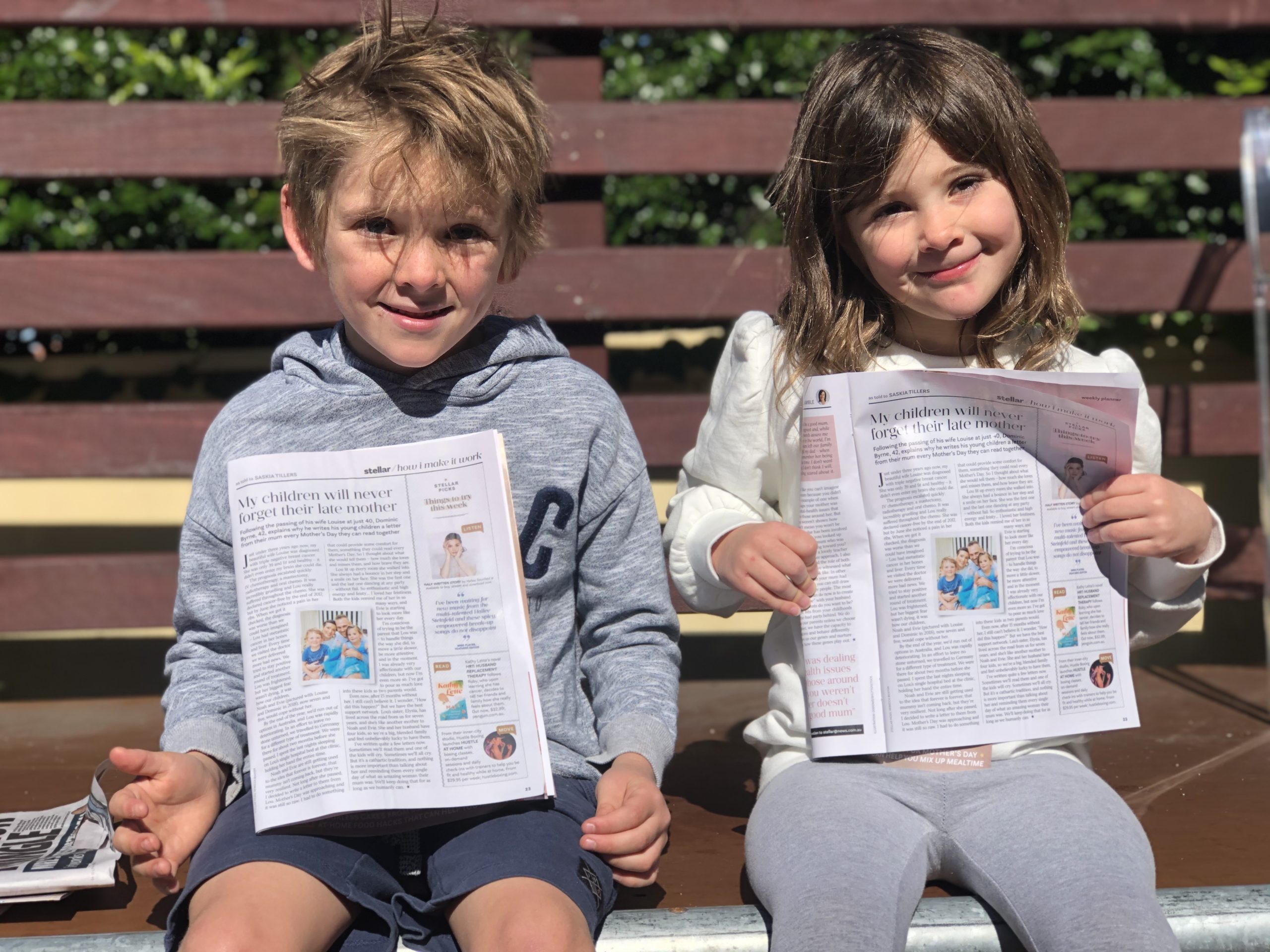 Evie and Noah reading Stellar Magazine on mothers day