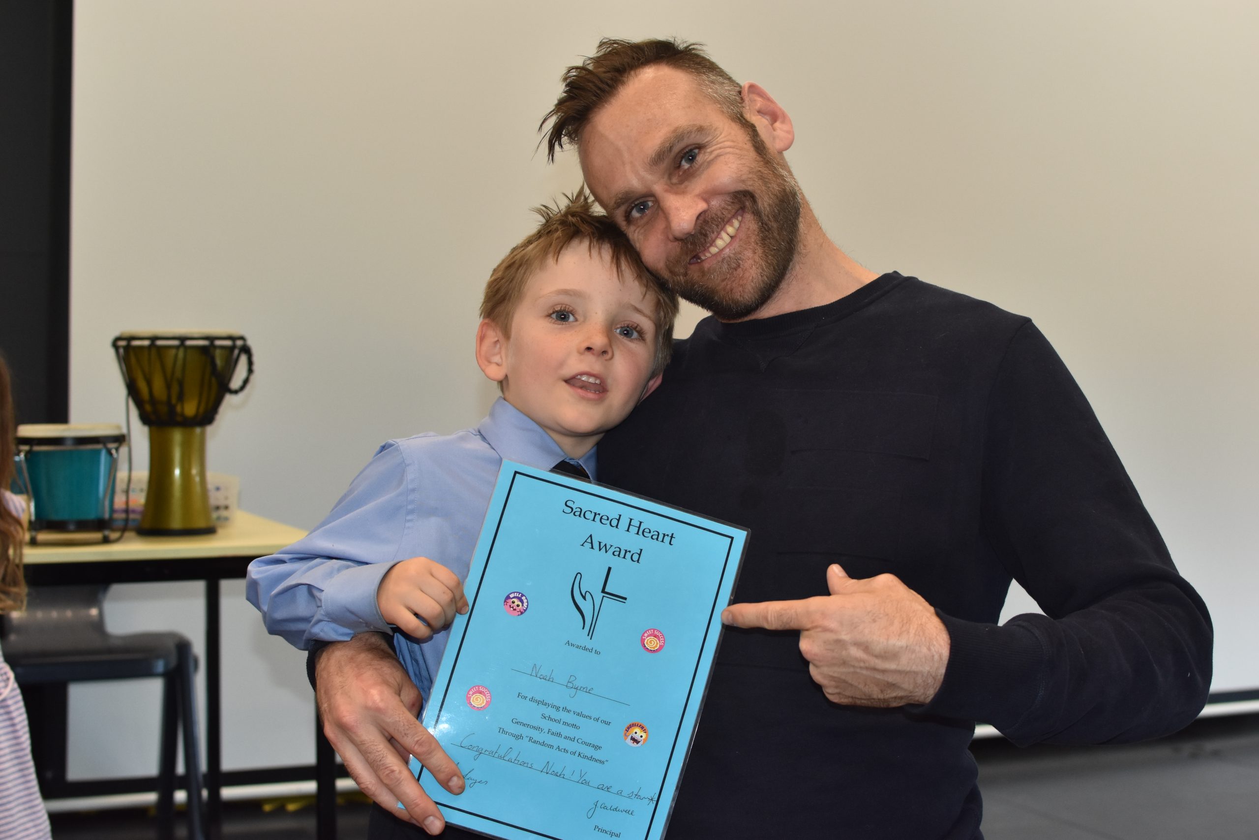 Dominic Byrne with Noah Byrne at Sacret heart getting the kindergarten blue award