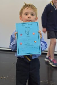 Noah Byrne getting the Kindergarten Blue award